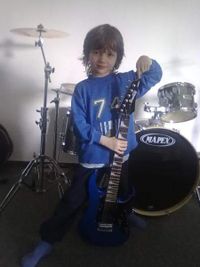 Dustin with his first Ibanez guitar at the age of 5